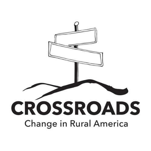 Crossroads Exhibit Logo. Crossed signs on a hillside..