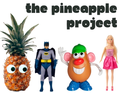 A pineapple with google eyes, Batman action figure, Mr. Potato Head, and a blonde Barbie.