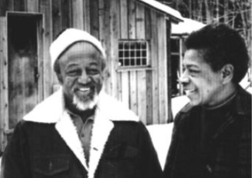 Iamge of people smiling in black and white.