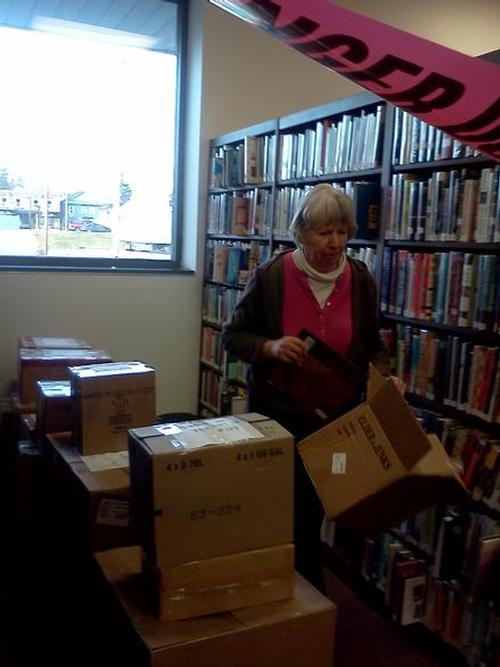Marie hard at work boxing up some of the Fiction books.
