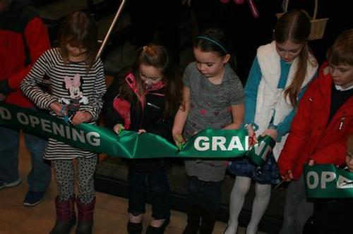 Children, the library’s future, cutting the ribbon at the Dedication Celebration.