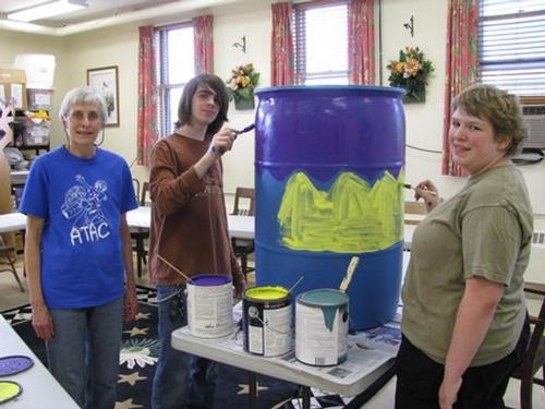 The Painting of a Rain Barrel for the Raffle