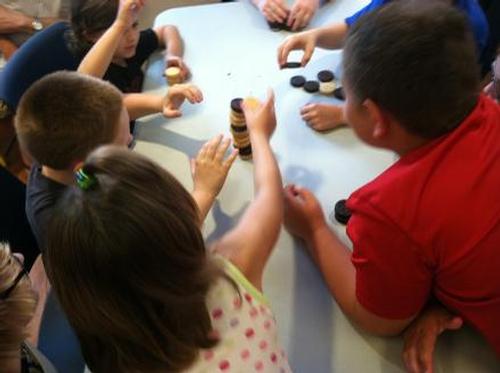 Oreo Stacking Competition from the Chocolate Olympics in the Children’s Library.
