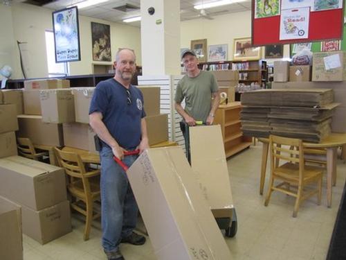 Volunteers Doug Wessel & Tom Ziniti help move items to our temporary location