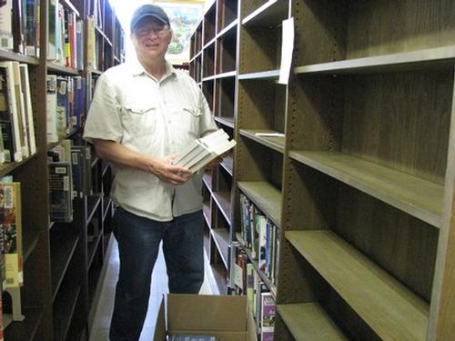David Hall volunteered to help pack books