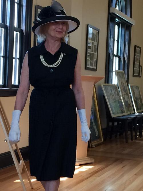 Modeling fashion of the past 100 years at the special 100 year Anniversary Tea Event at the library.