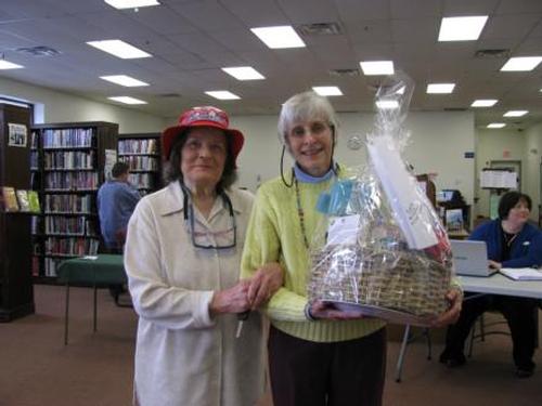 Joyce Rychlik was the winner of the raffle basket created by members of ATAC. With Rychlick is library staff member and ATAC advisor, Anne Cutler- Russo.